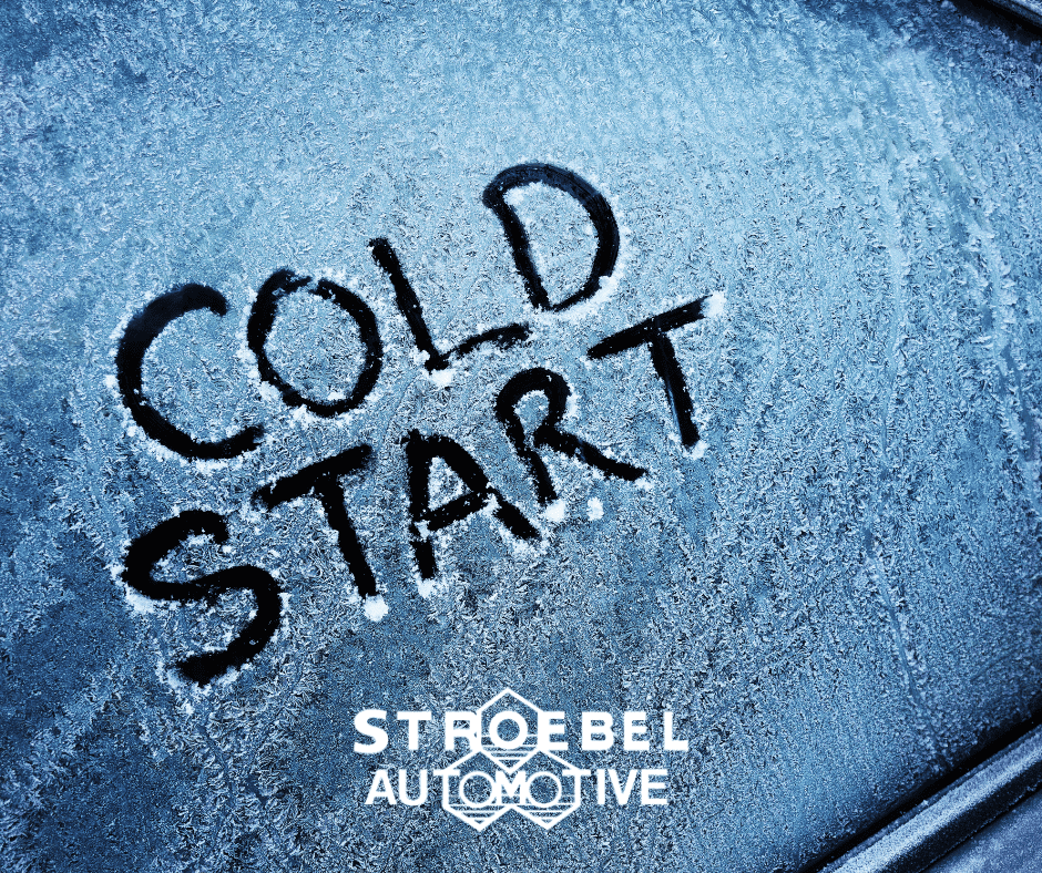 Cold start message written on frosted car window, symbolizing winter vehicle startup. Frosted car window with "Cold Start" message written in snow, ice-covered vehicle surface.